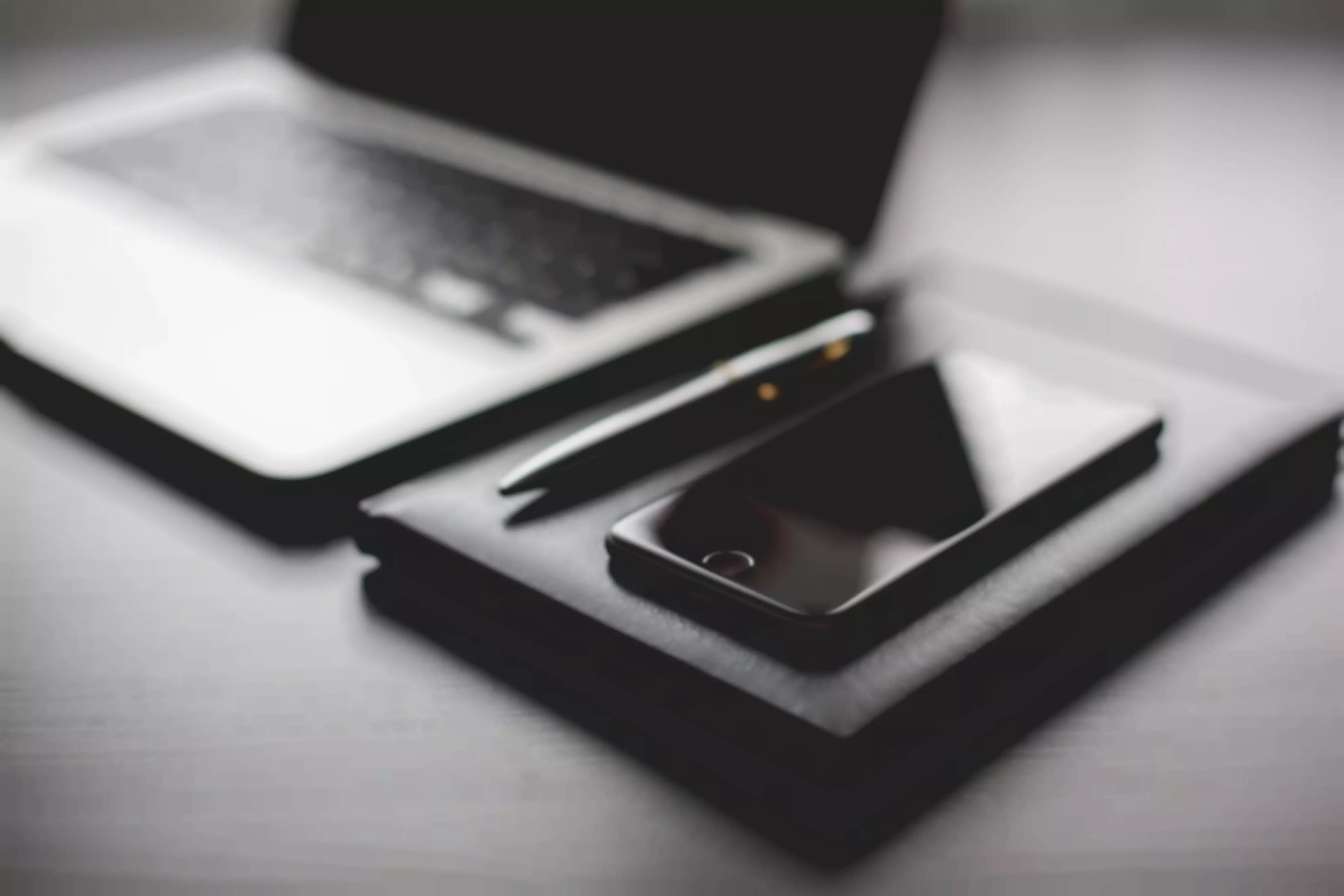 black working setup diary and iphone
